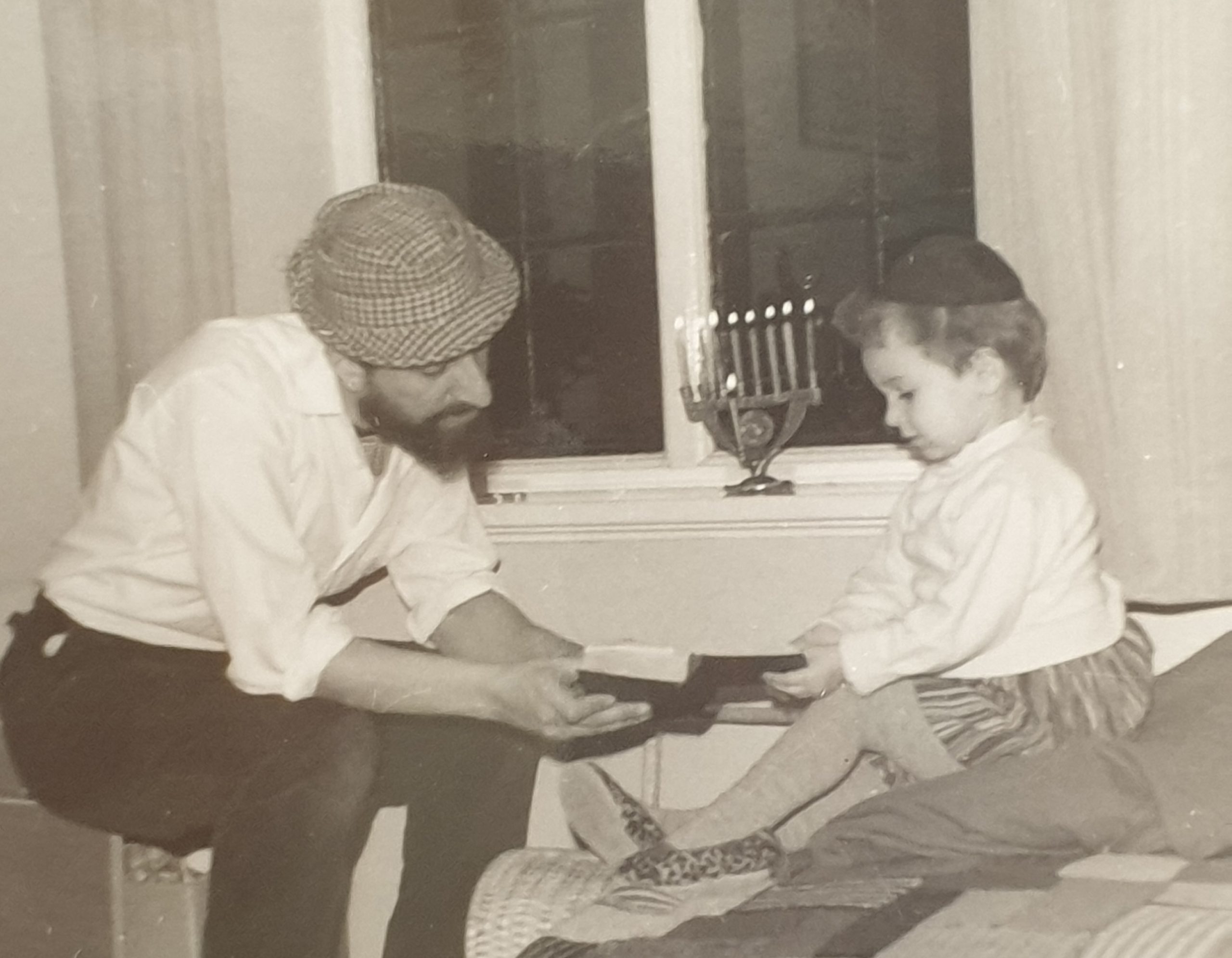 Clem Lighting Chanukiah Aged 4.